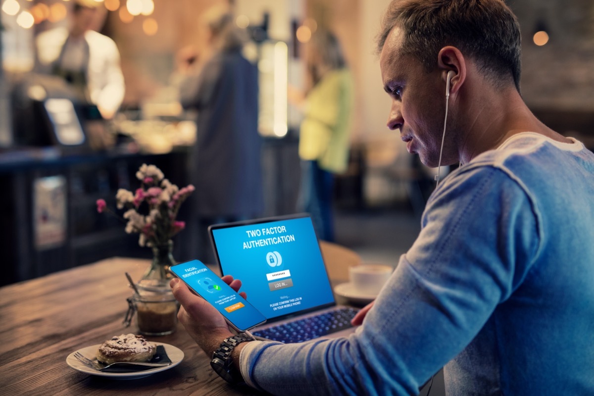 man using laptop and two-factor authentication