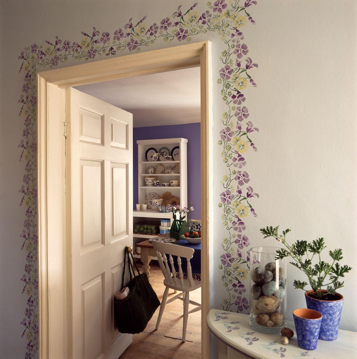 Hallway with decoration round doorway to kitchen