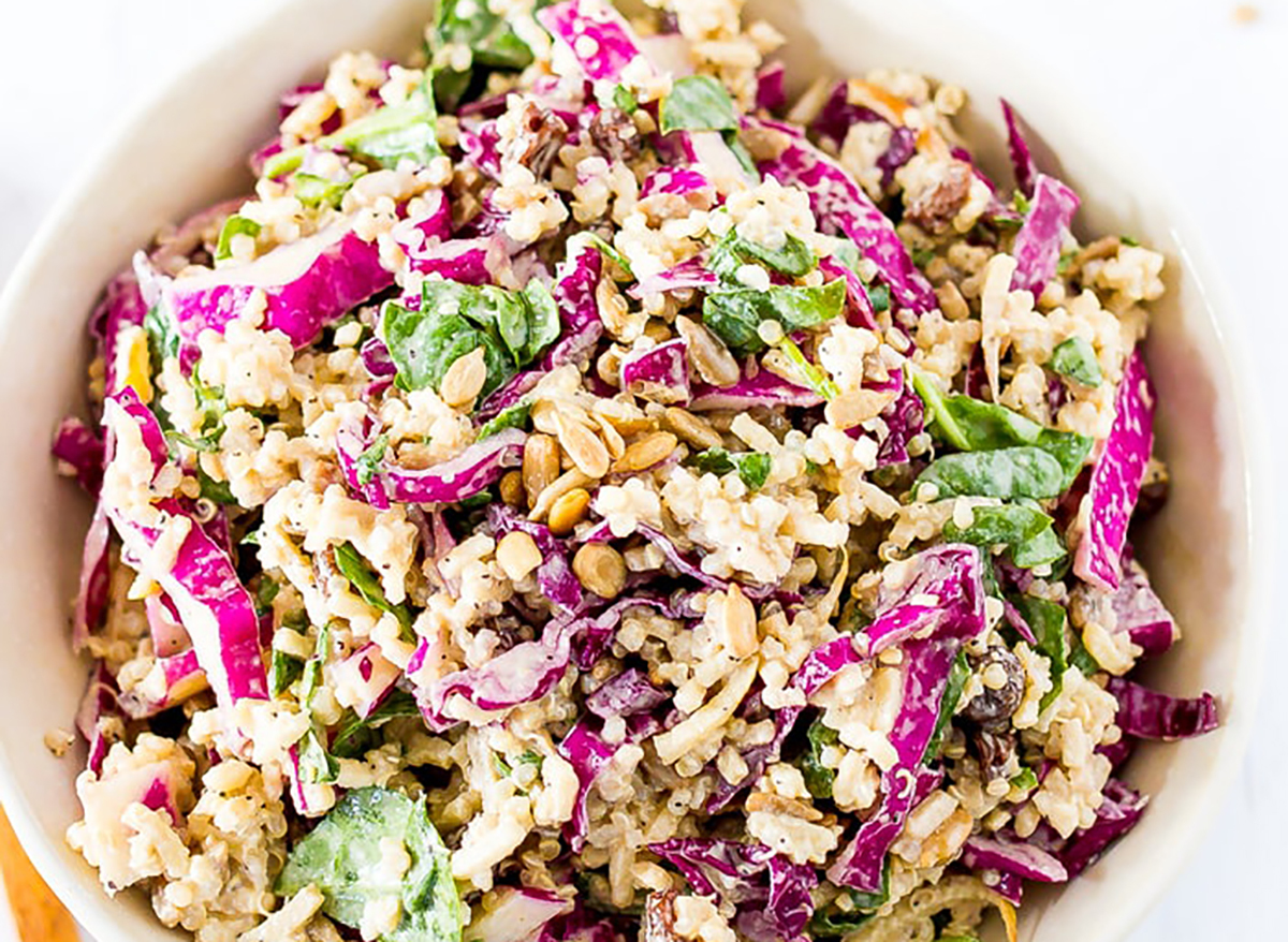 spiralized apple slaw with cabbage mixed together in a bowl