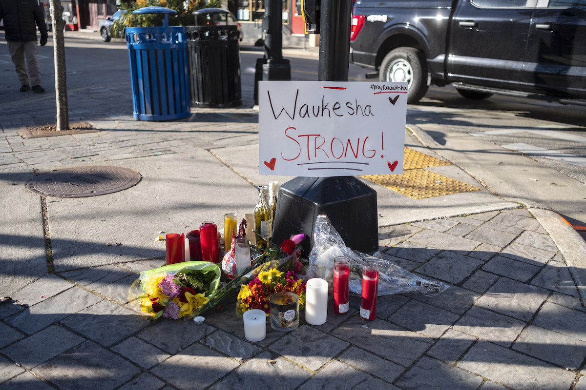 A memorial with flowers and candles for victims of the Waukesha Parade Attack photographed in November 2021