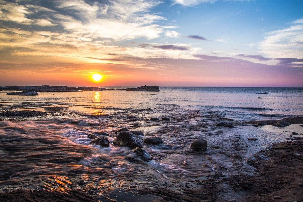 ocean and rocks in Munising, Michigan at dusk