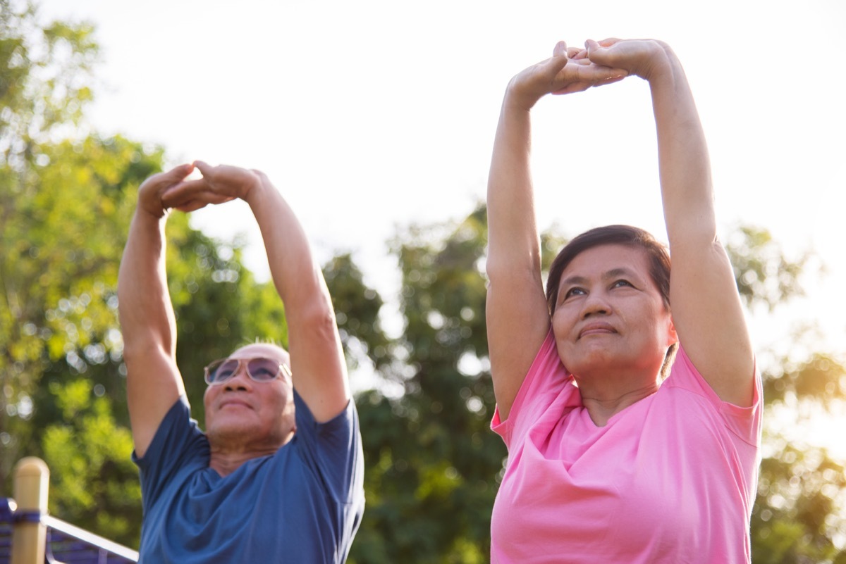 Older people stretching warming up