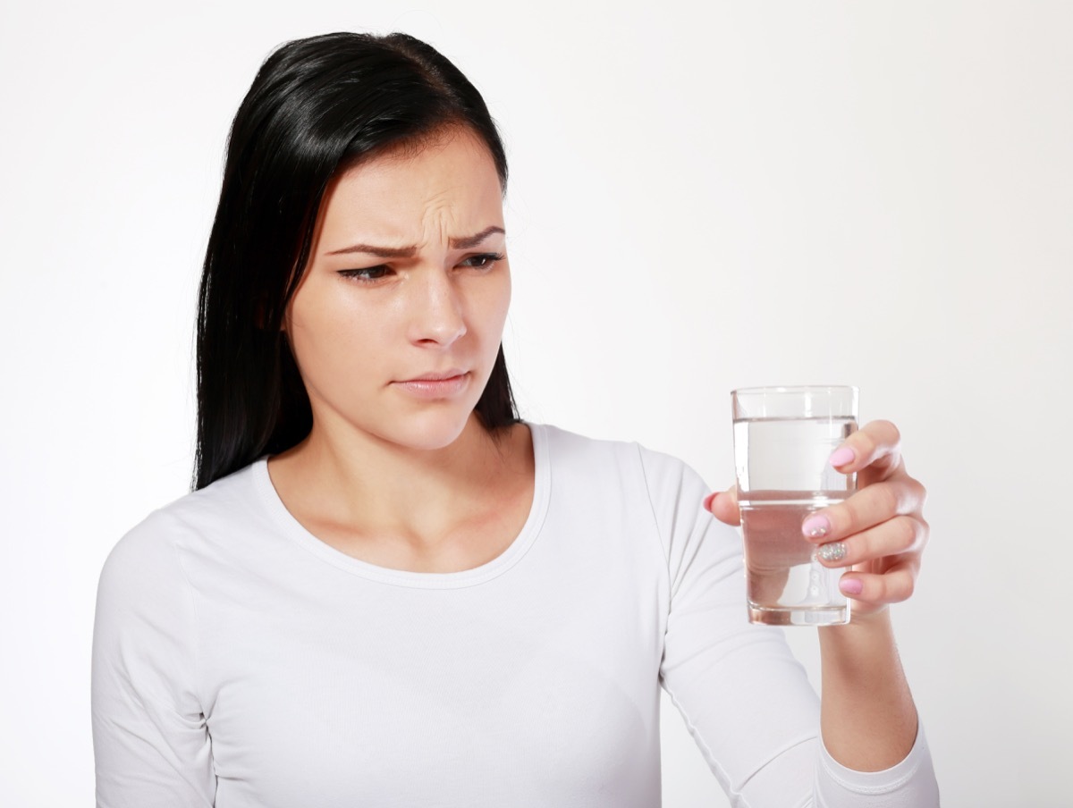 dangerous water young asian woman looking at water looking unhappy or disgusted