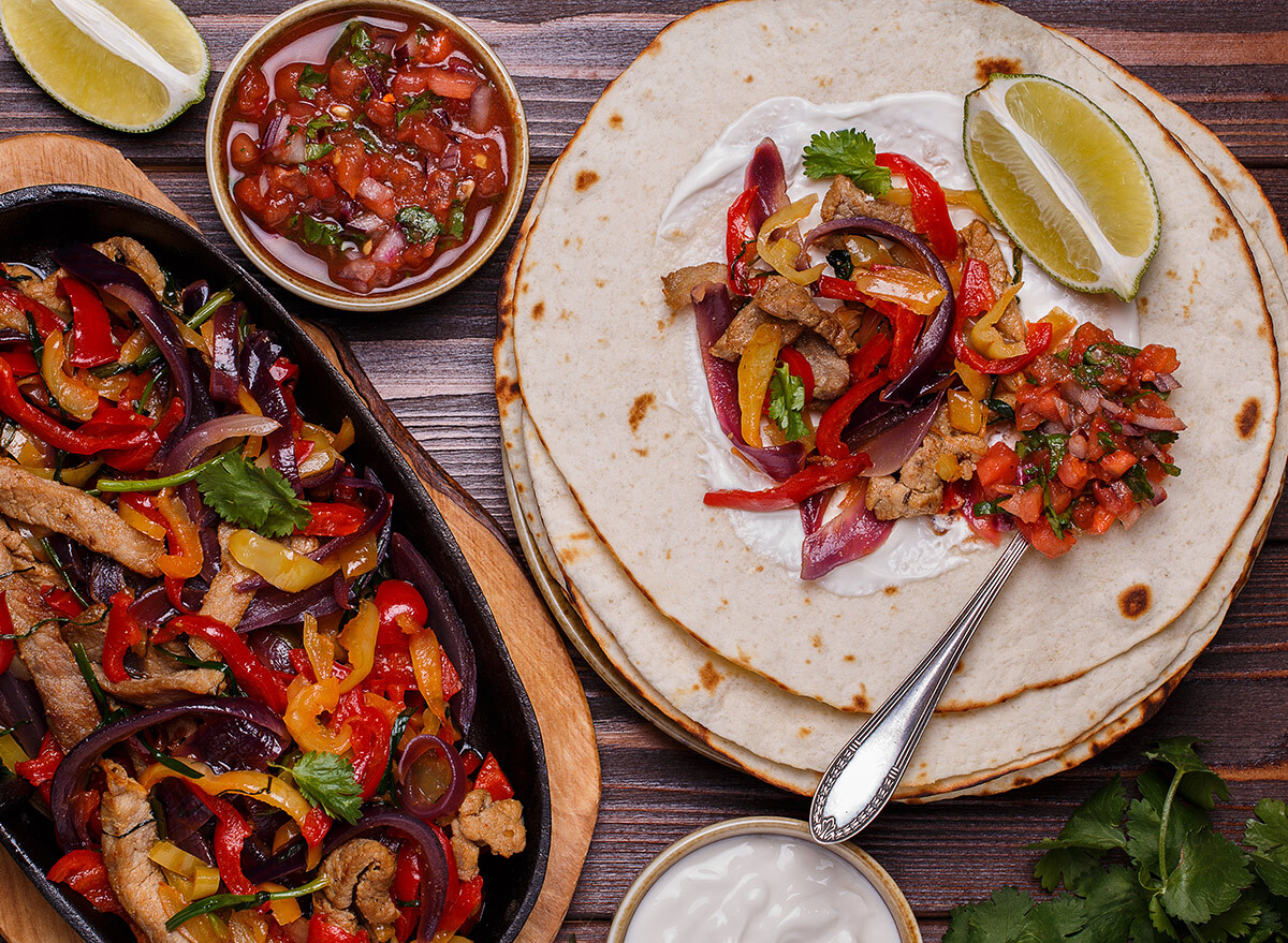 Fajitas with sour cream on the tortilla