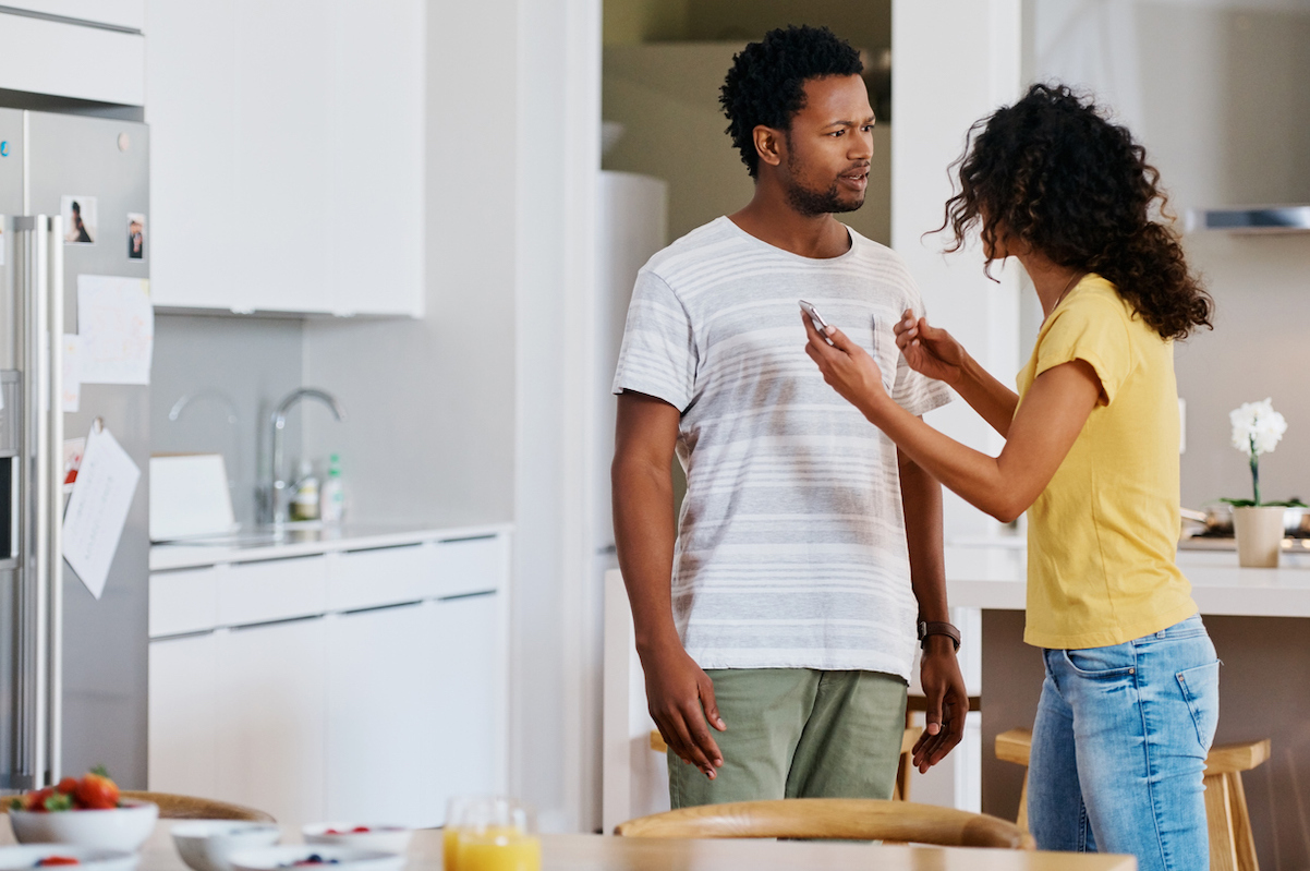 young married couple having an argument at home