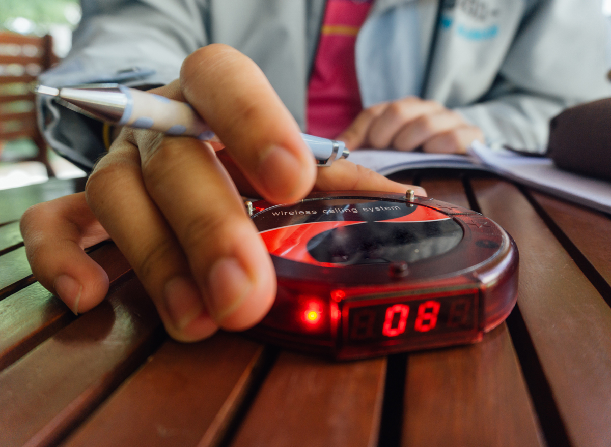 Restaurant host with wait list buzzer