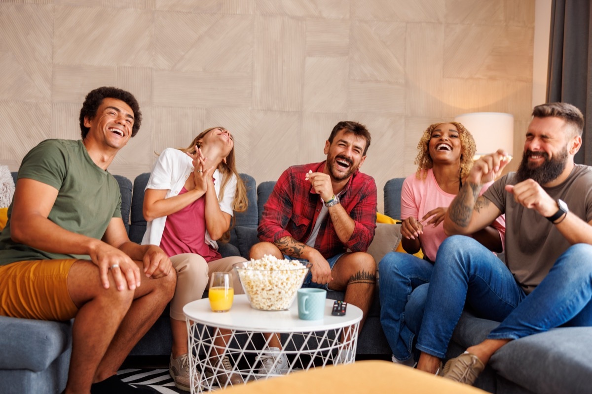 Group of friends laughing and playing game