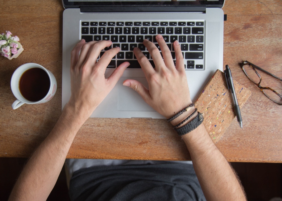 author writing on computer