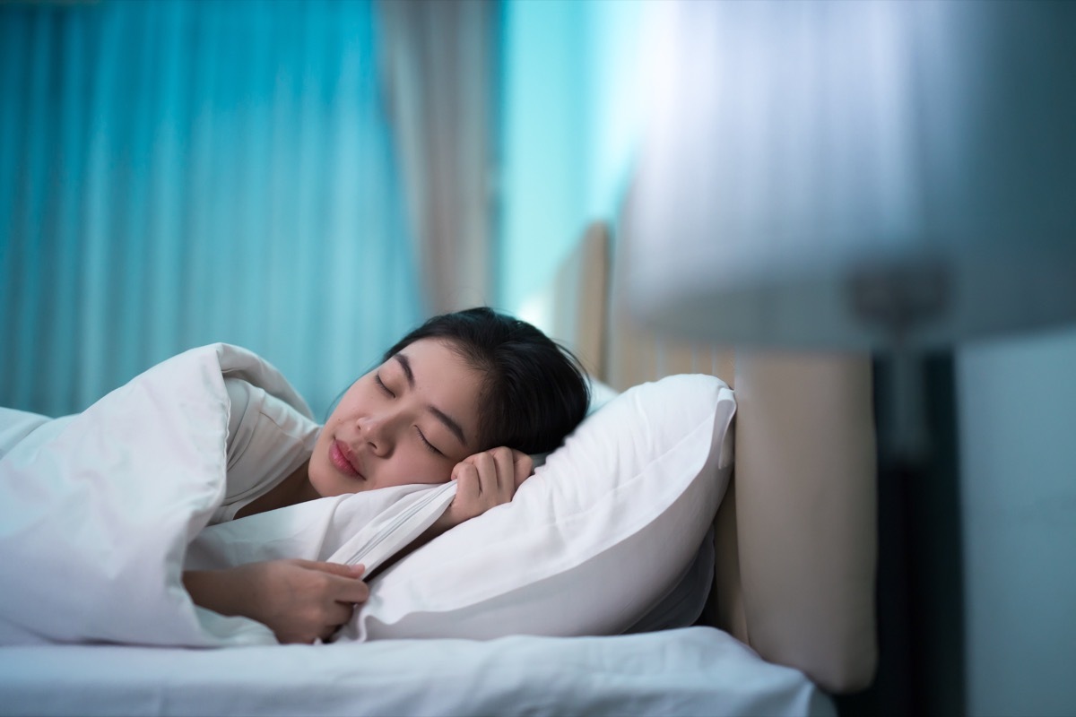 Asian woman sleeping in bed