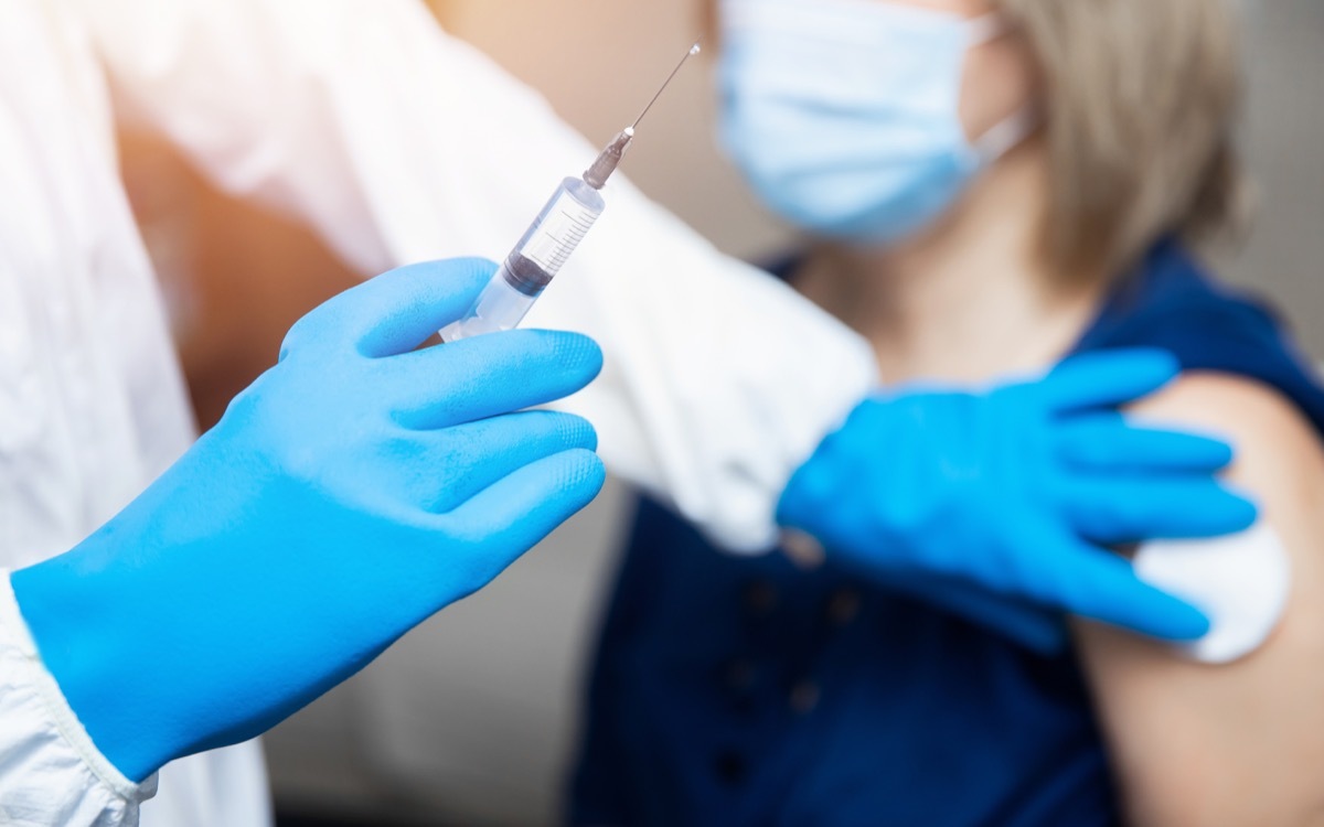 Woman getting COVID vaccine