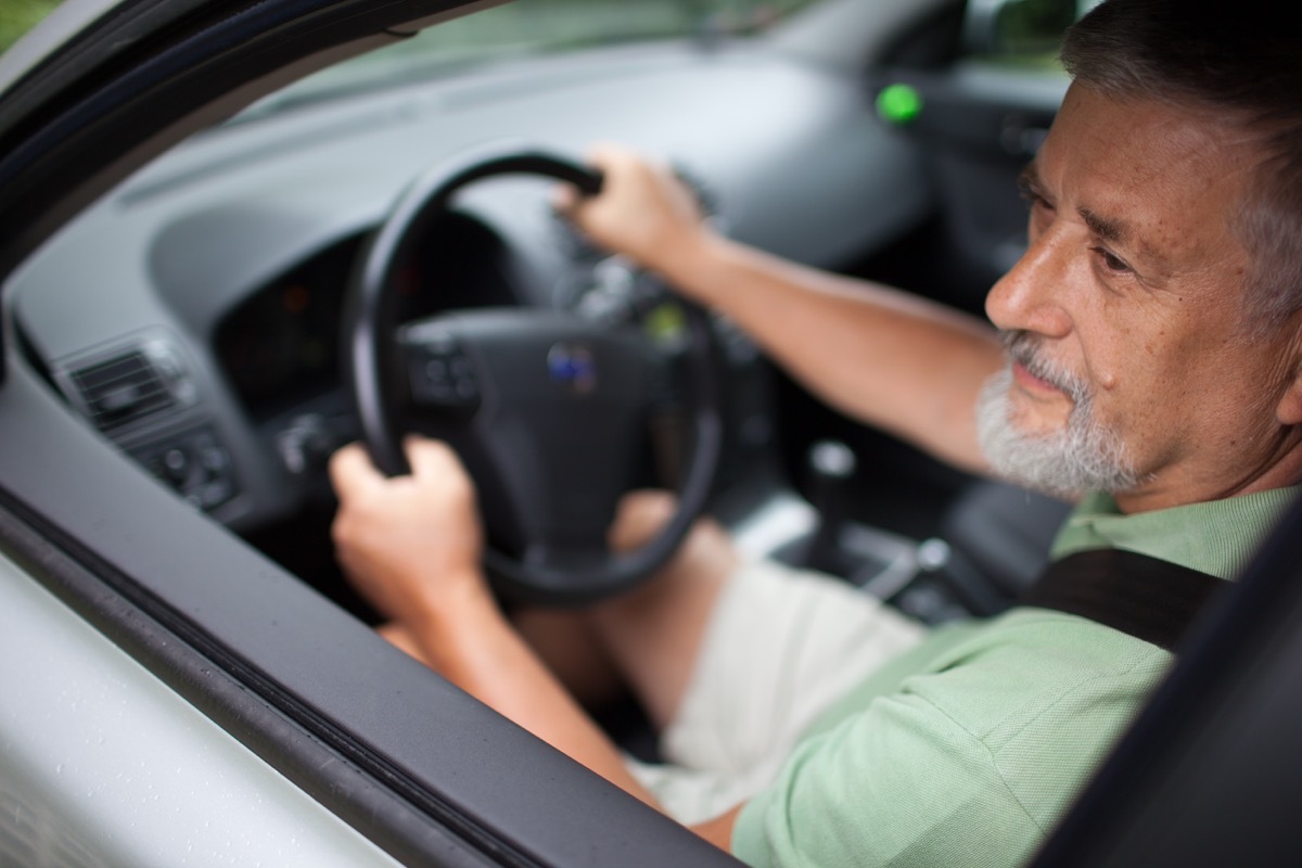 Older man driving a car