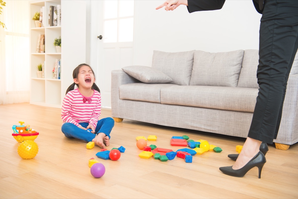 mom telling crying child to clean her room