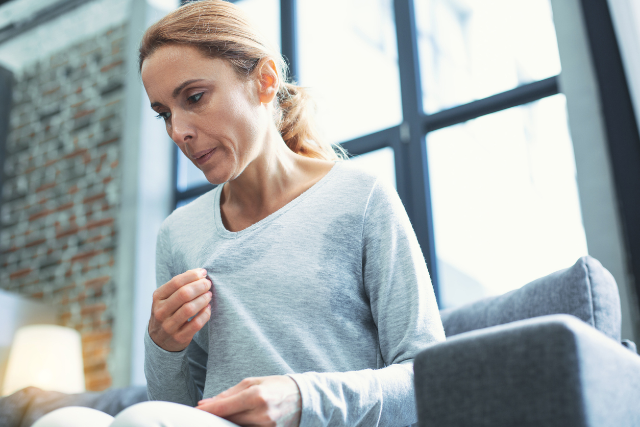 Woman feeling nervous and sweating. 