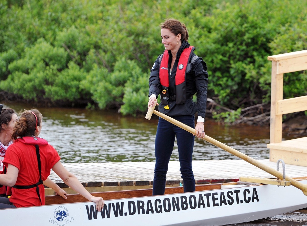 The Duchess of Cambridge steers a dragon boat before a race against her husband, across a lake in Dalvey by-the Sea, on Prince Edward Island in eastern Canada.