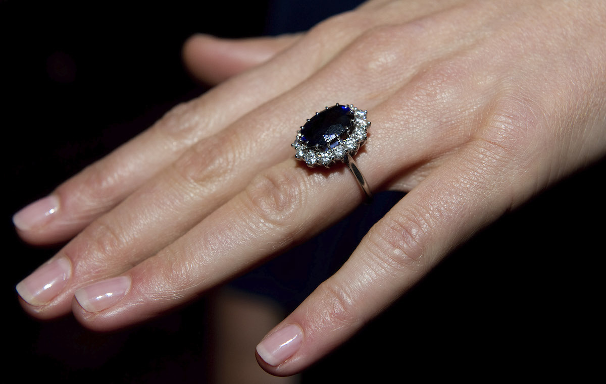 A close up of Kate Middleton's engagement ring as she poses for photographs in the State Apartments with her fiance Prince William