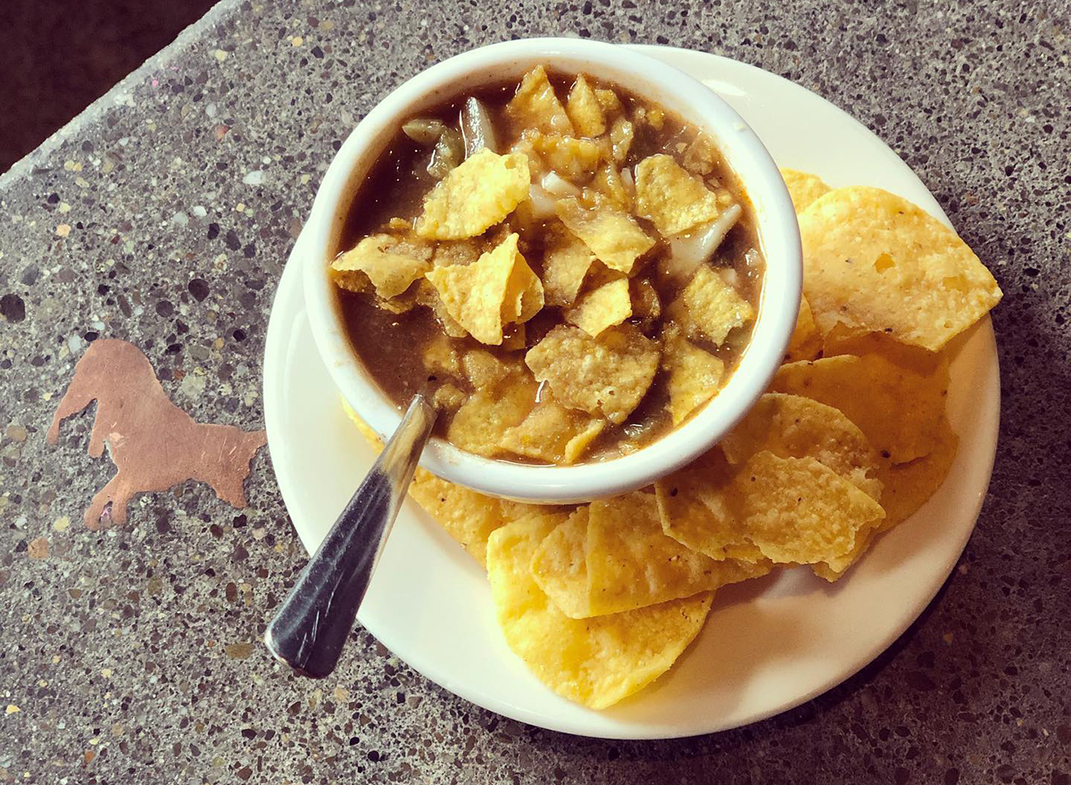 bowl of black bean soup topped with tortilla chips