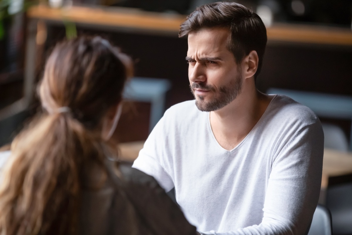 Man looking skeptically at woman