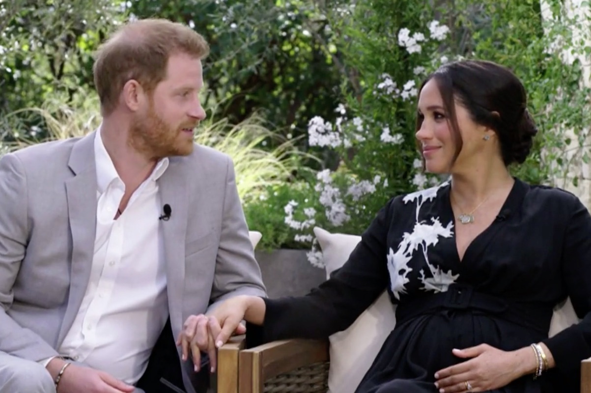 Harry and Meghan clench hands while talking about the Queen during Oprah interview on CBS on Mar. 7