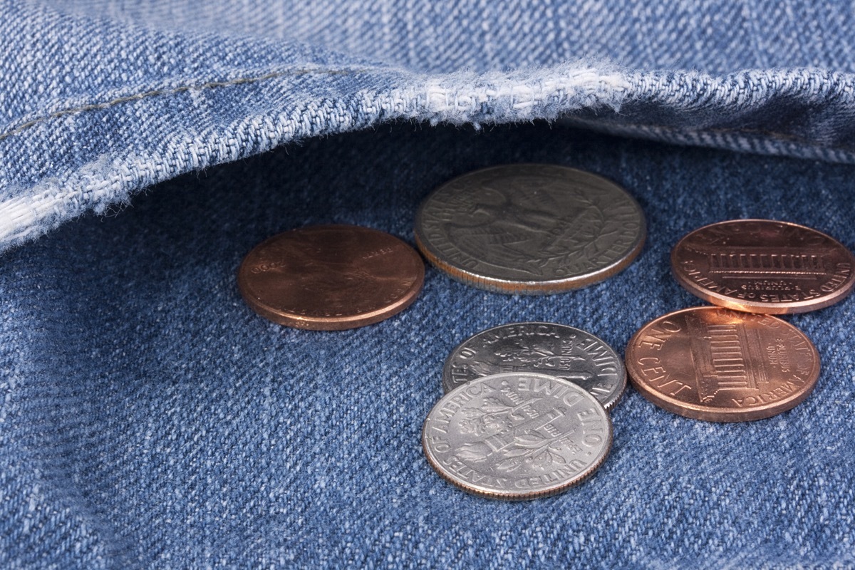 coins in the pocket of jeans