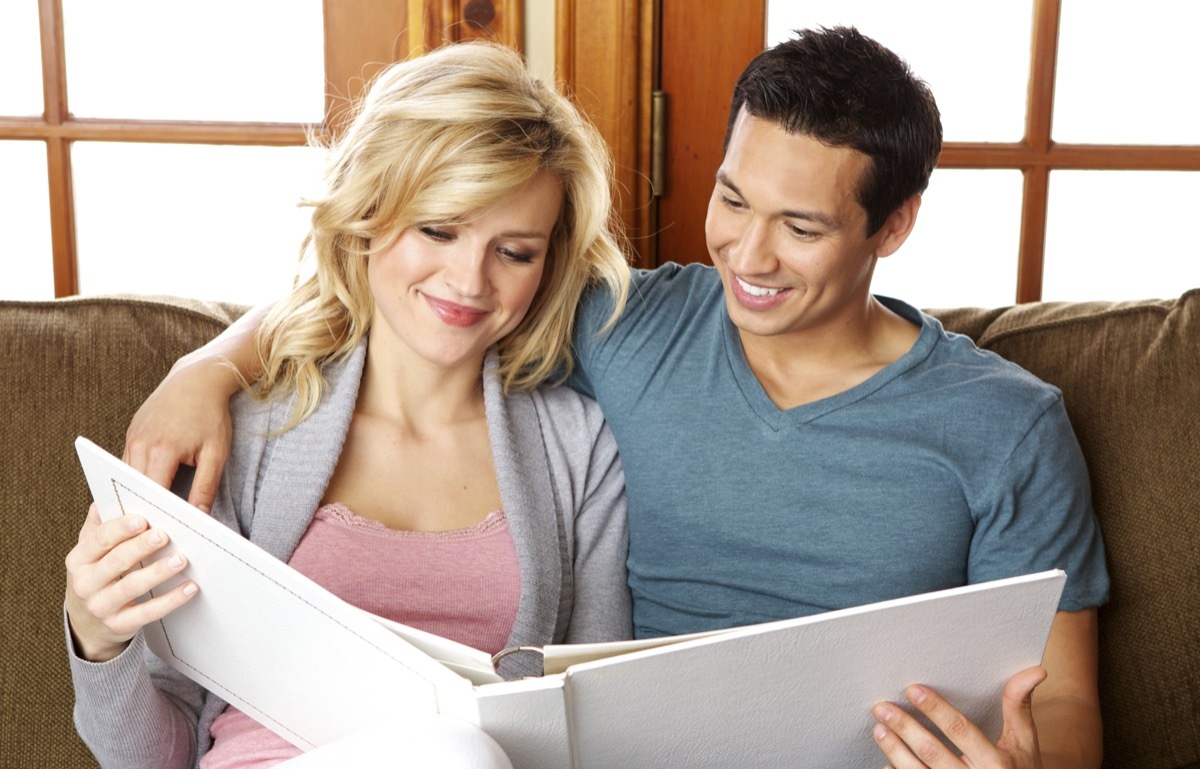 Couple looking at a photo album together